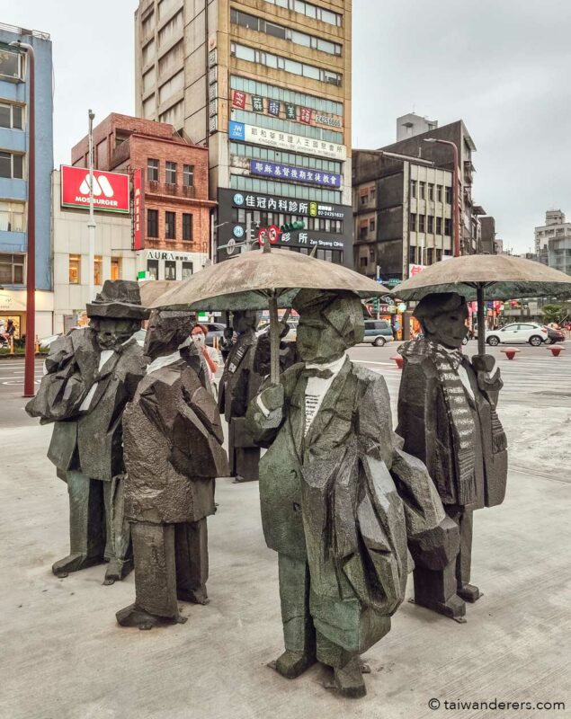 men people umbrellas statue keelung