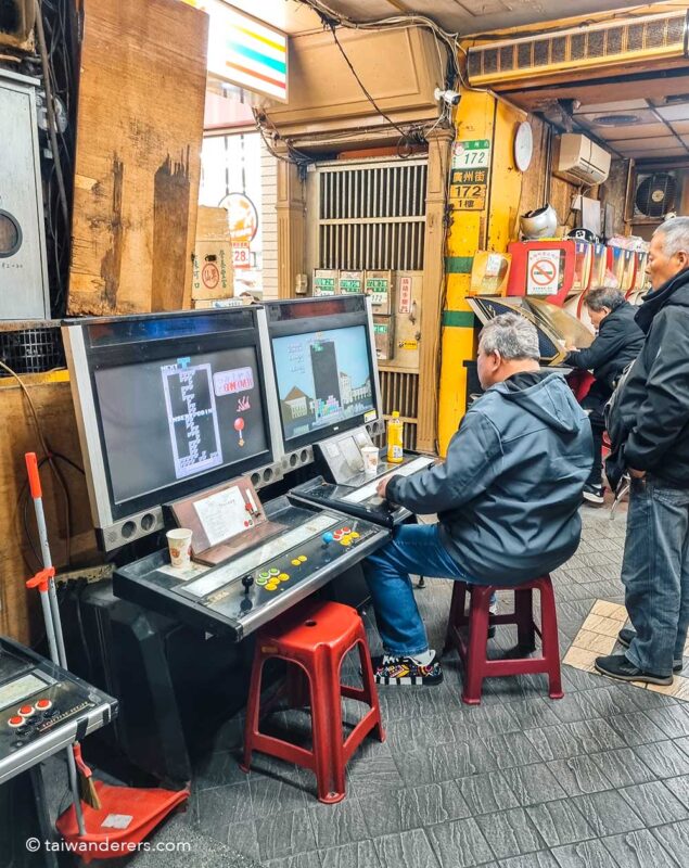 groups of old men were competitively playing Tetris on the street in wanhua taipei