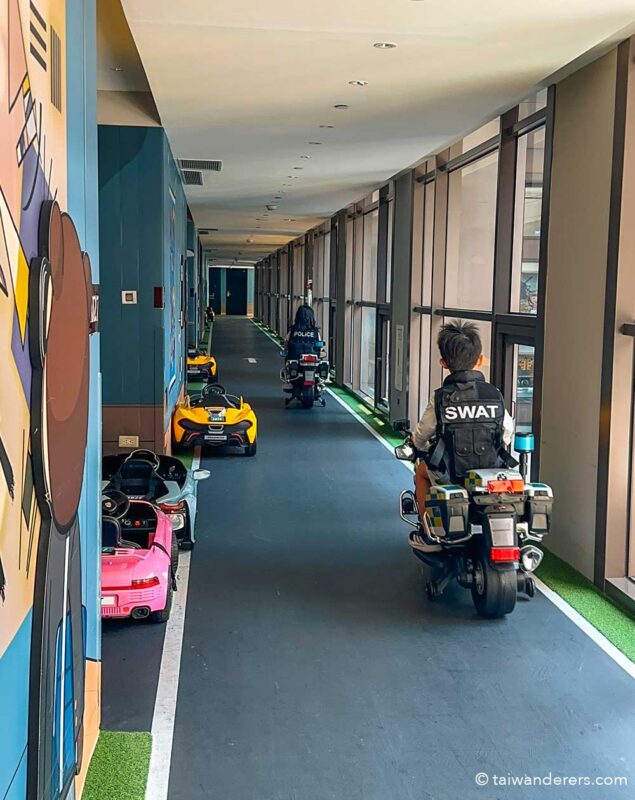 Silks Place Yilan hotel. Racing corridor for kids toy electric cars
